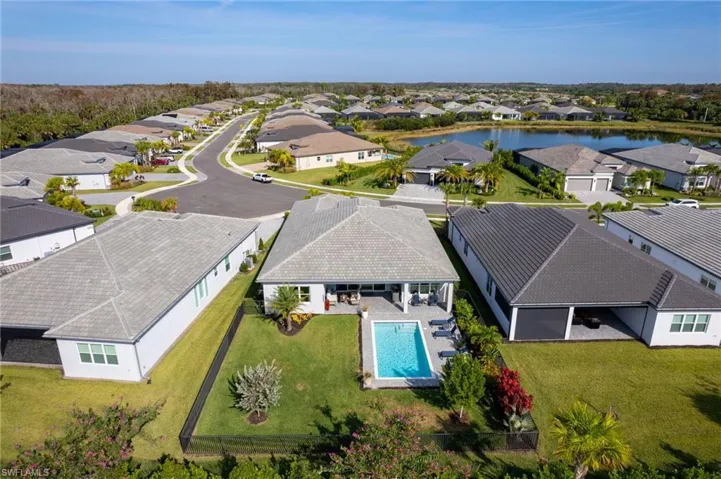 Aerial view of residential area featuring a pool