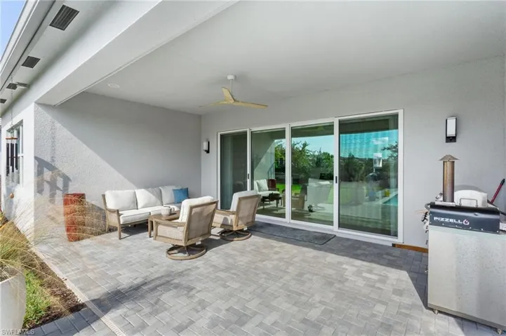View of patio / terrace featuring an outdoor living space and a ceiling fan