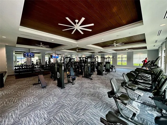 Workout area featuring wood ceiling and a ceiling fan