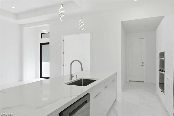Kitchen island with integrated sink and chrome faucet