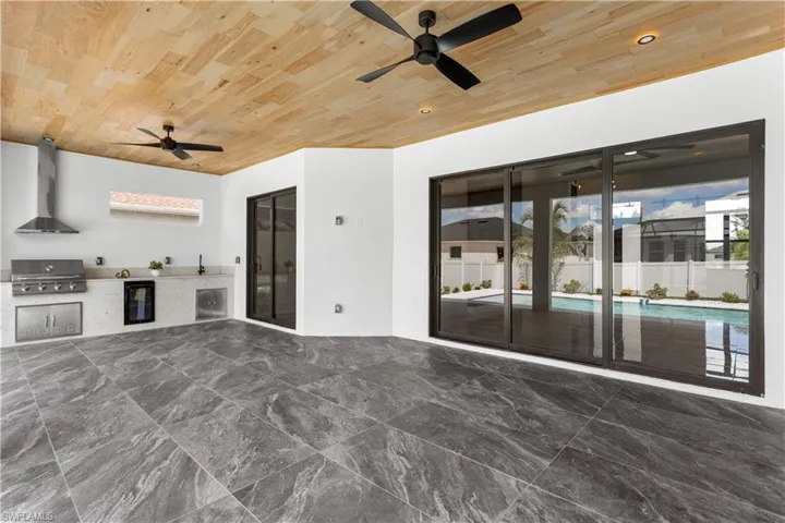 Expansive lanai features FLAT WOODEN CEILING & offers ample space for LOUNGING & ENTERTAINING ensuring MEMORABLE GATHERINGS.