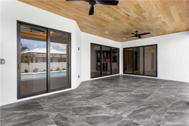 Expansive lanai features FLAT WOODEN CEILING & offers ample space for LOUNGING & ENTERTAINING ensuring MEMORABLE GATHERINGS.