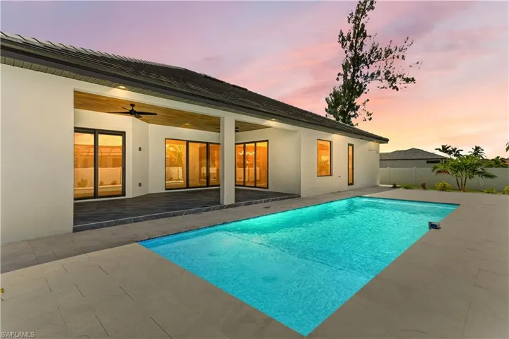 Twilight photo of the pool lanai area