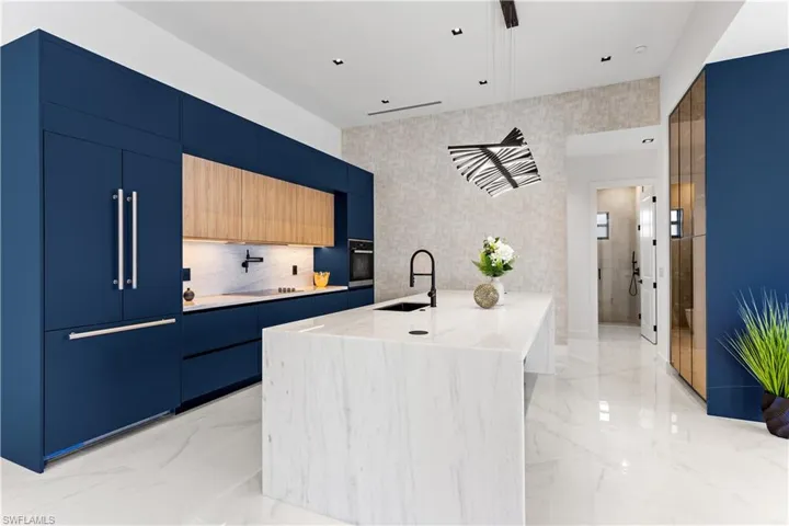 THIS HOME EXUDES CHARACTER, featuring ELEGANT PALETTE of BLUE & BLACK and serene NATURAL BEIGE WOOD TONE & WHITE accents!