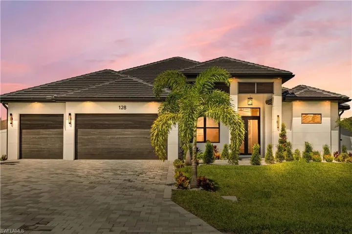 Twilight photo of the front of the property