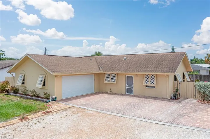 Single story home featuring a garage