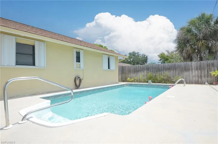 View of swimming pool with a patio area