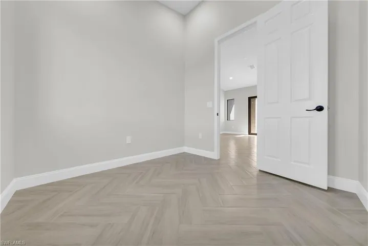 Empty room featuring baseboards
