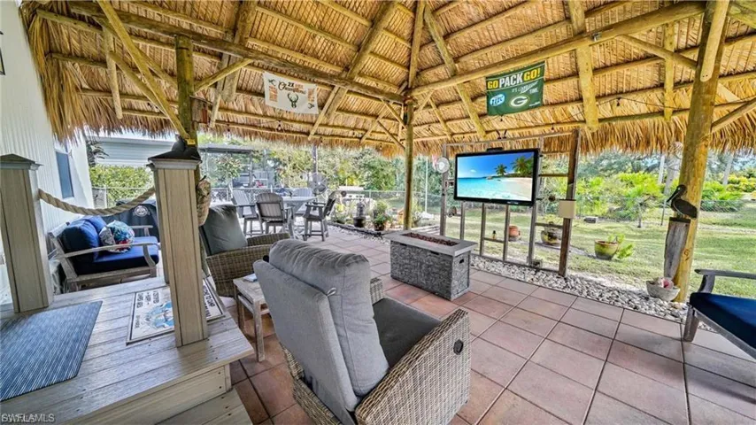 View from inside Tiki Hut. with an outdoor living / dining area