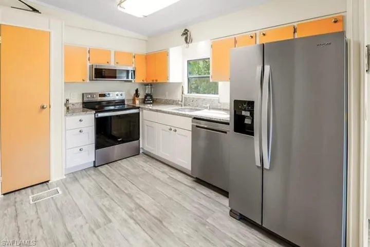 Kitchen featuring stainless steel appliances and light wood-type flooring