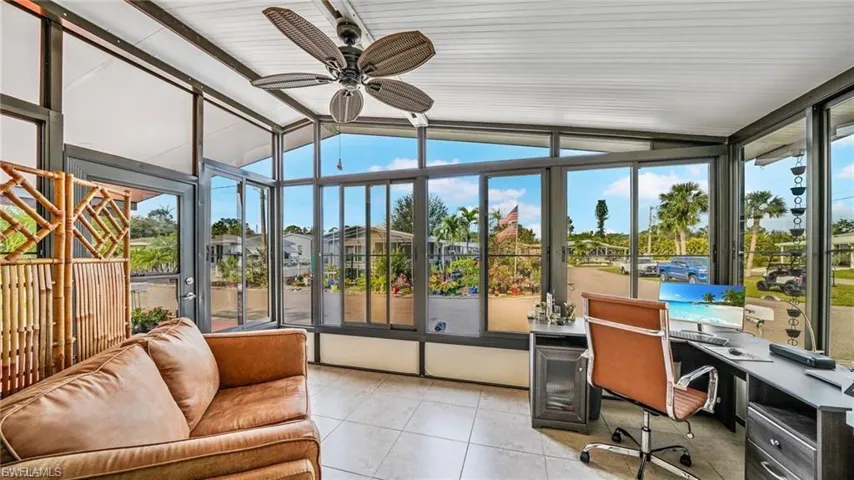 Sunroom / solarium featuring tile patterned floors