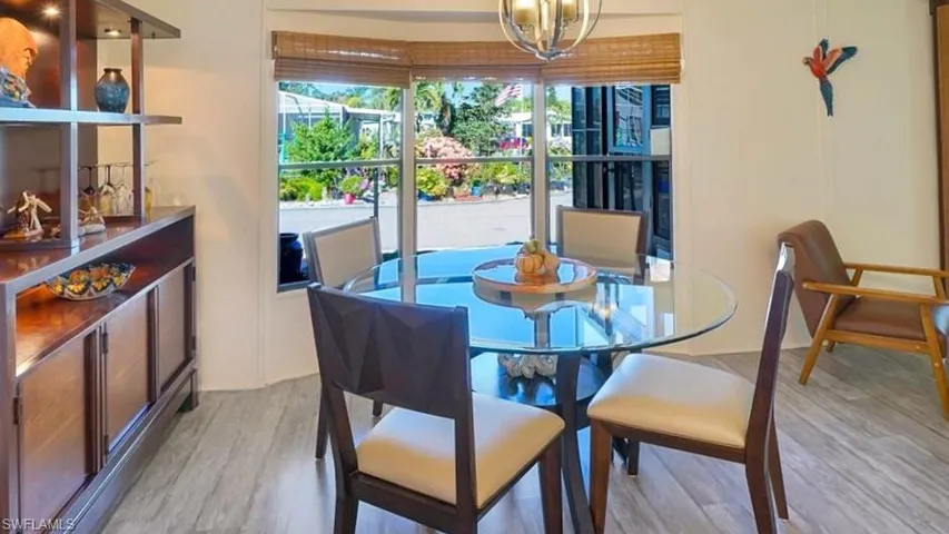 Dining room featuring light wood-type flooring and hanging lights