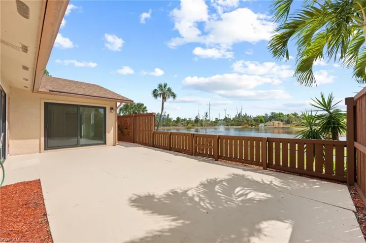 View of yard with a water view and a patio area