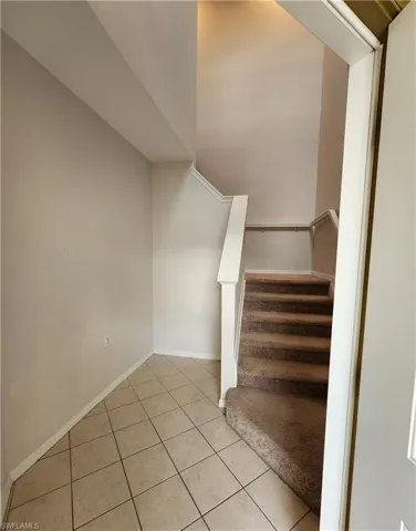 Stairway featuring tile patterned flooring