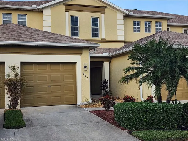 View of front facade featuring a garage