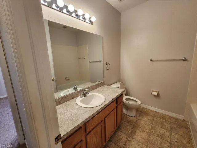 Bathroom with toilet and vanity
