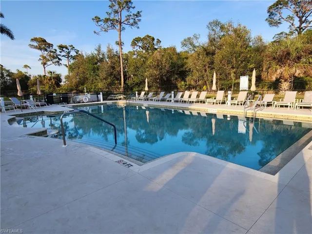 Community pool with a patio area