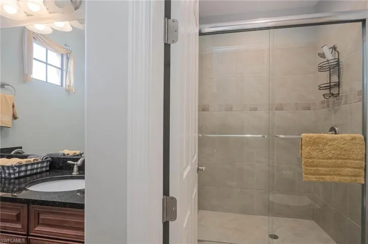 Bathroom with vanity and walk in shower