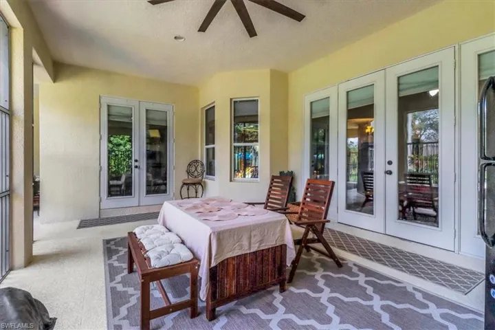Sunroom / solarium with french doors and plenty of natural light