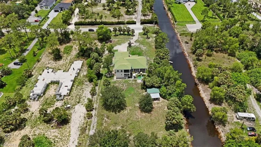 View of property location with a large body of water and nearby suburban area