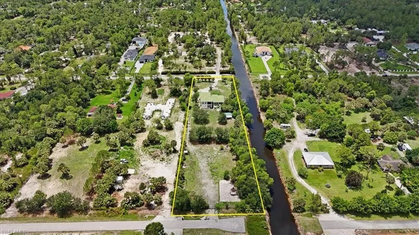 Aerial view of residential area with property parcel outlined