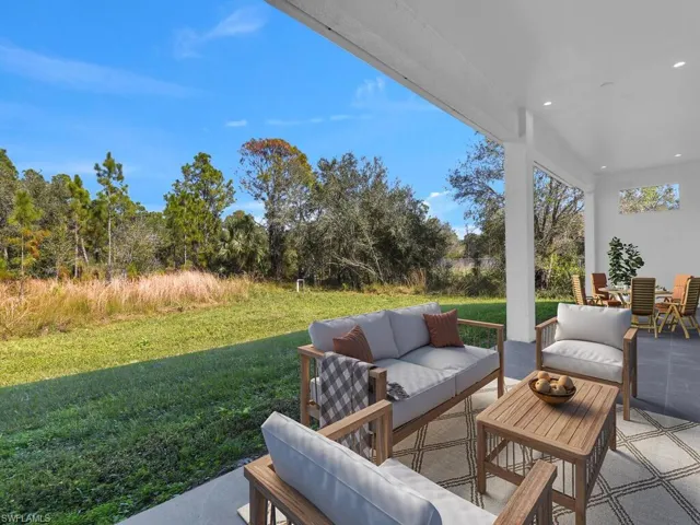 View of patio with an outdoor living space. Furnitures are not included.
