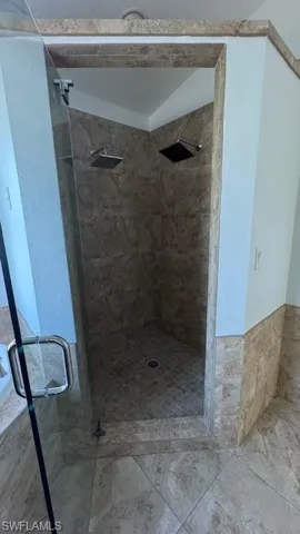 Full bathroom featuring a stall shower