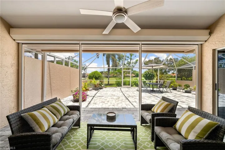 Sunroom / solarium featuring ceiling fan