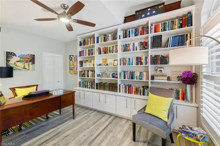 Office space with ceiling fan and light hardwood / wood-style floors