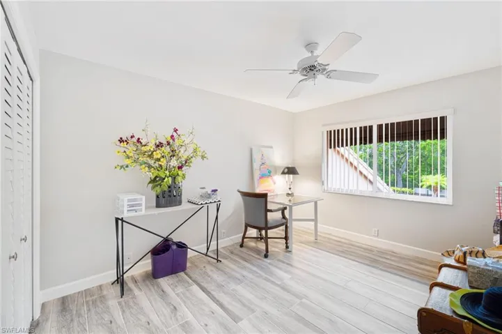 Office area featuring ceiling fan and light wood-type flooring