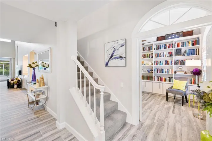 Staircase featuring light hardwood / wood-style floors