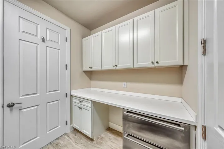 laundry room with sub zero freezer