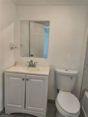 Full bathroom featuring vanity and toilet