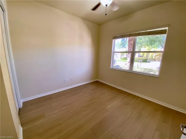 Unfurnished room featuring light wood-style floors and a ceiling fan