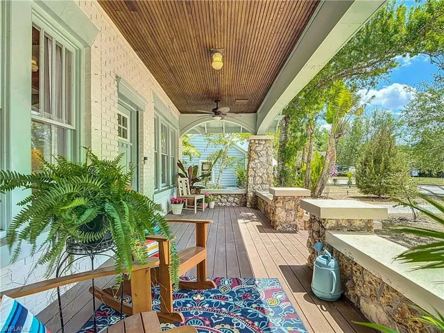 Deck featuring a porch and ceiling fan