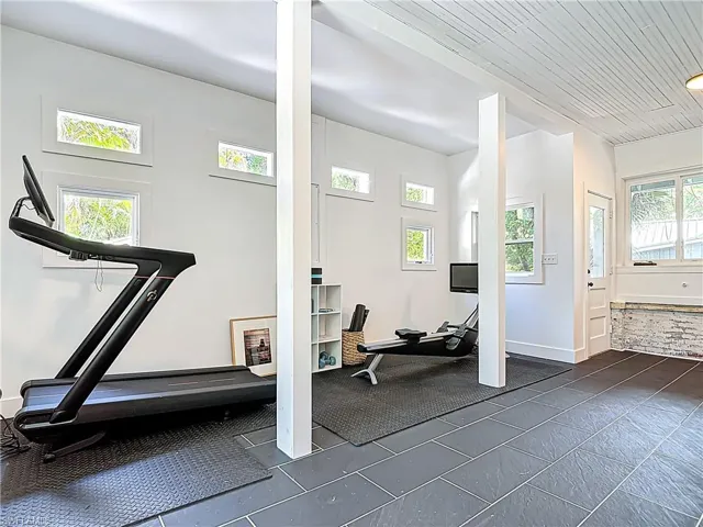 Exercise room featuring baseboards
