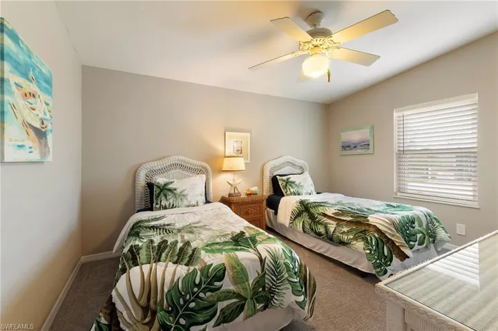 Bedroom featuring carpet flooring and a ceiling fan