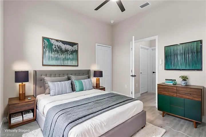 Bedroom featuring ceiling fan and wood finished floors