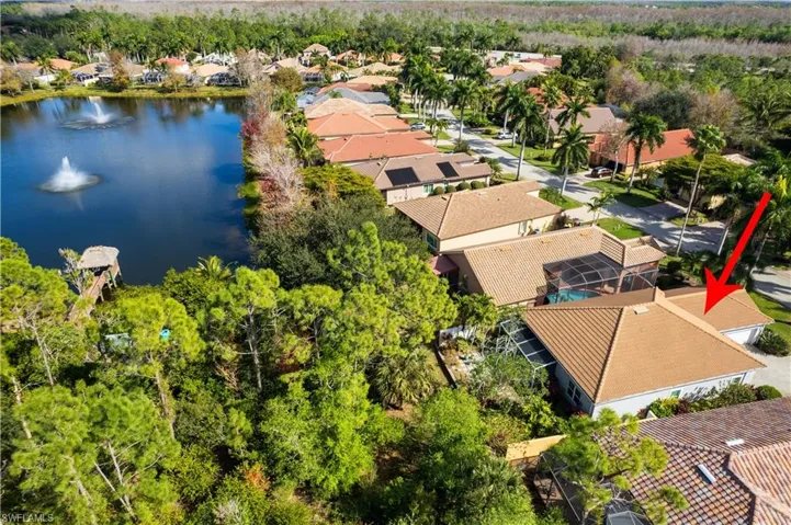 Aerial perspective of suburban area featuring a large body of water