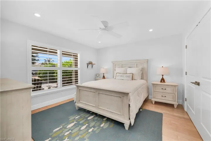 Bedroom featuring light wood finished floors, recessed lighting, and a ceiling fan