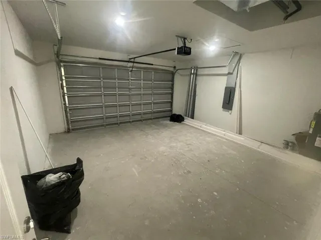 Garage featuring a garage door opener