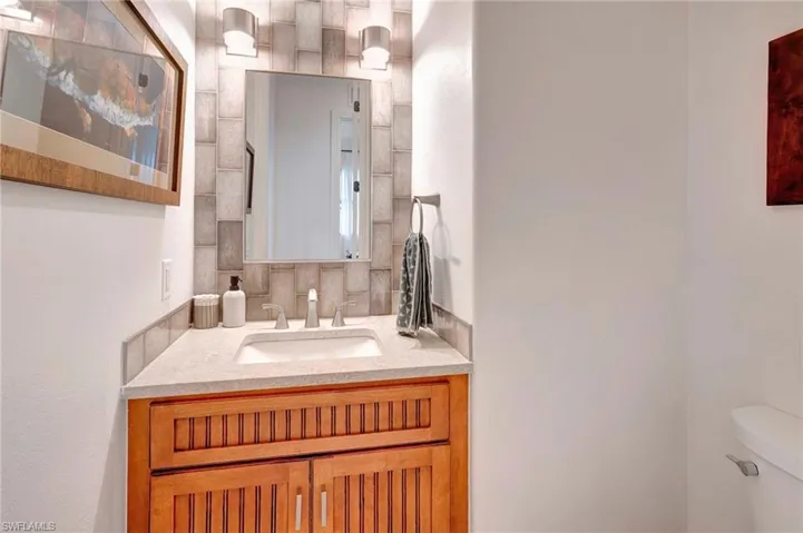 Bathroom featuring vanity and toilet