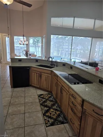 Dock area featuring boat lift and a water view