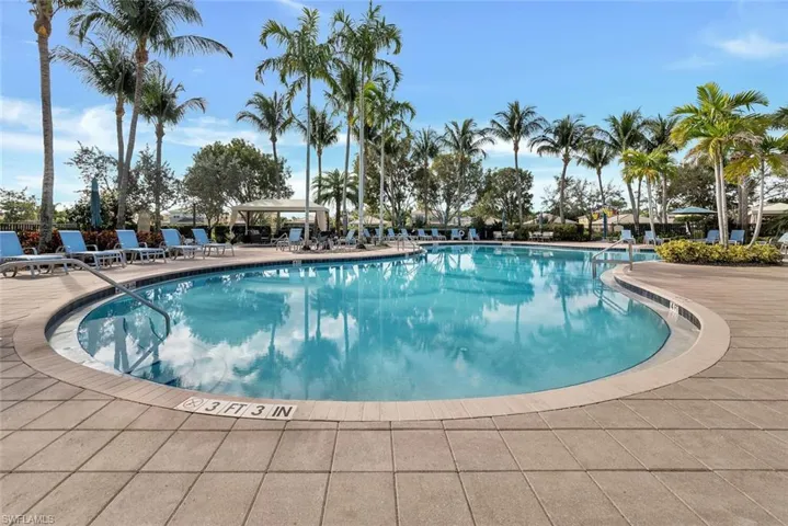 Resort style pool with lots of seating.