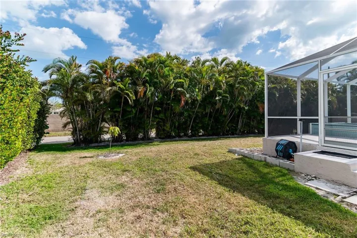 View of yard with glass enclosure