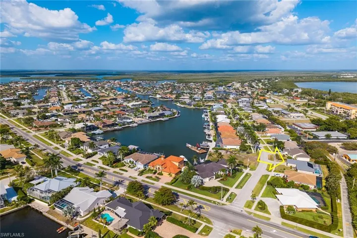 Drone / aerial view featuring a residential view and a water view