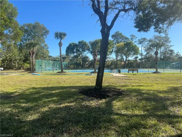 View of community featuring a lawn