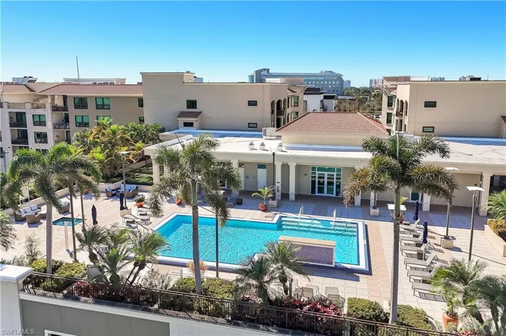 Community pool with a patio