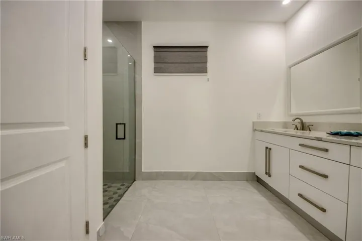 Bathroom with vanity and walk in shower