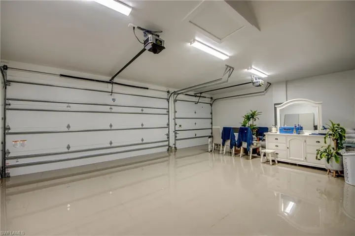 Garage featuring a garage door opener